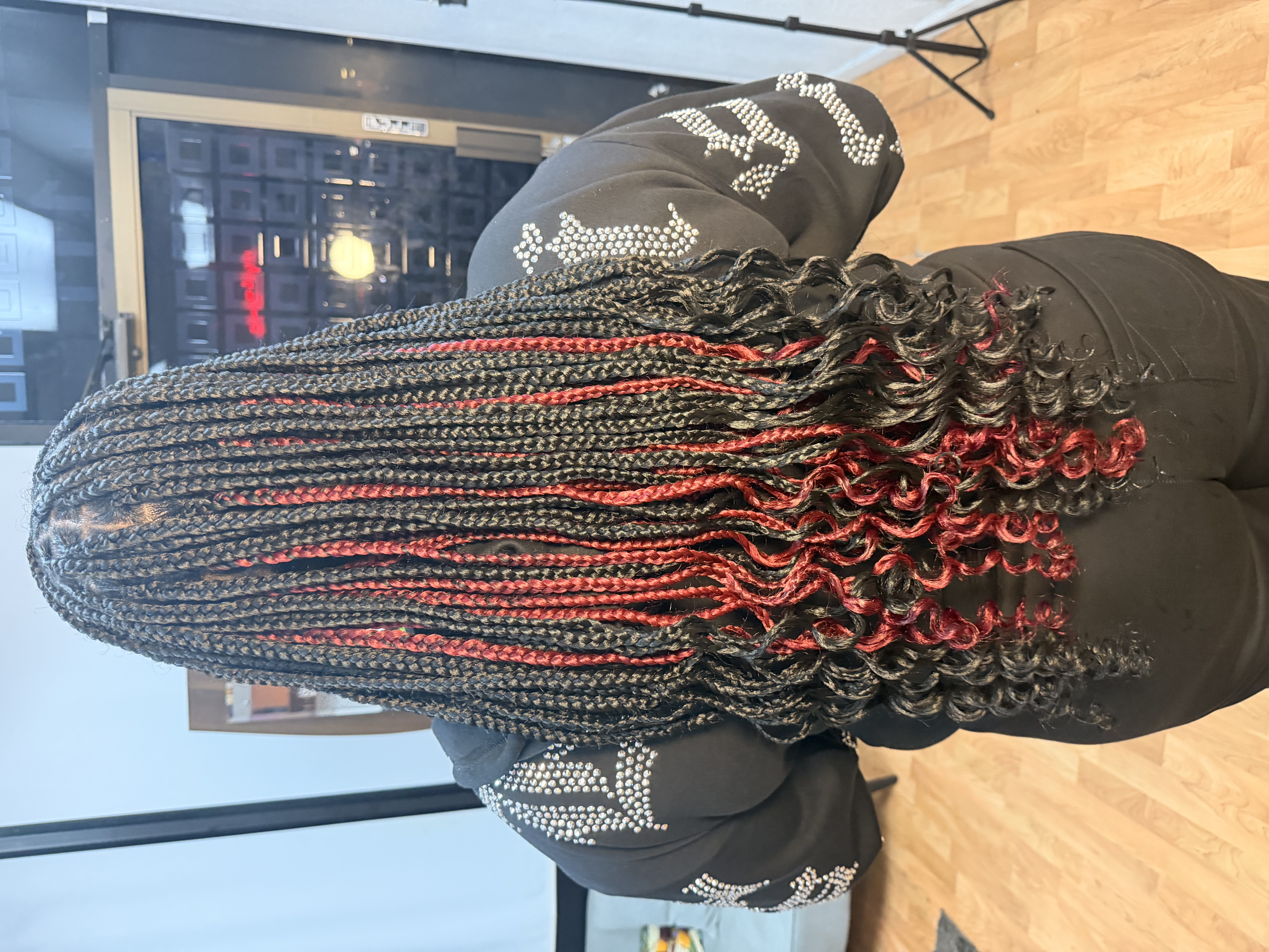 Black and red highlighted braids with curly ends - MJADE Beauty
